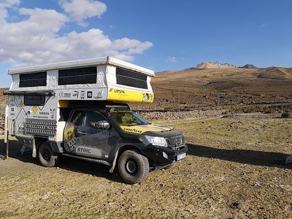 Camp in island near volcano.